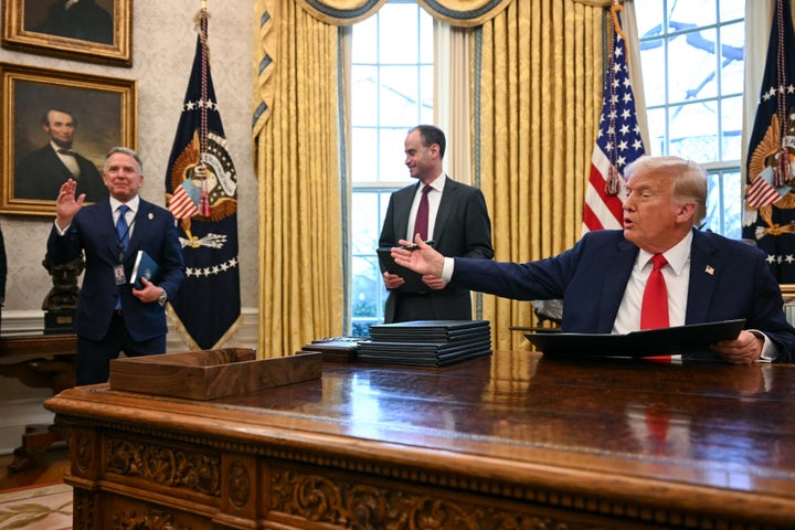 Trump gestures to Witkoff, left, as Trump signs an executive order to create a U.S. sovereign wealth fund, in the Oval Office on Monday, Feb. 3.