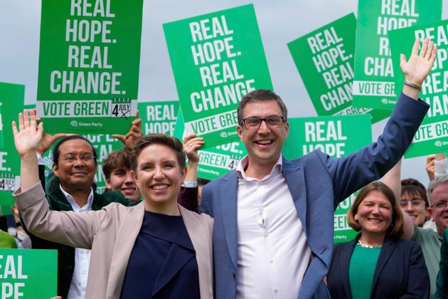 Green Party co-leaders Adrian Ramsay, right, and Carla Denyer pose with supporters at their General Election Manifesto launch in Hove, England, on June 12, 2024.