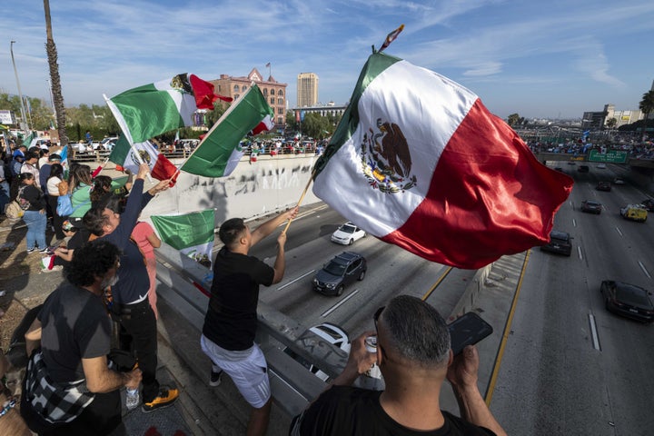 People take part in the "A Day Without Immigrants" march in downtown Los Angeles on Monday.