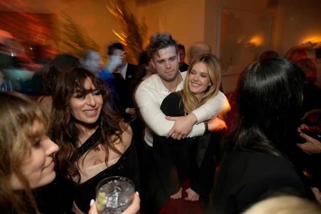 Leo Woodall and Meghann Fahy partying with the rest of the White Lotus cast at an Emmys after-party last year