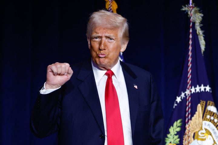US President Donald Trump gestures as he arrives to speak during the National Prayer Breakfast at the Washington Hilton in Washington, DC, on February 6, 2025. 