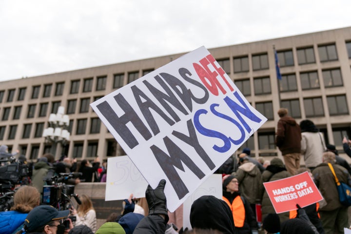 People rally against Elon Musk and DOGE outside the U.S. Department of Labor in Washington on Feb. 5, 2025.