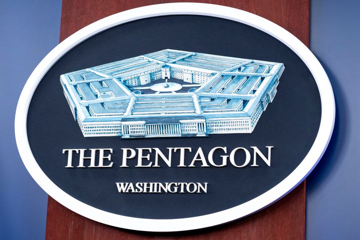 The Department of Defense logo is seen on the wall in the Press Briefing room at the Pentagon, Oct. 29, 2024, in Washington. (AP Photo/Kevin Wolf, File)