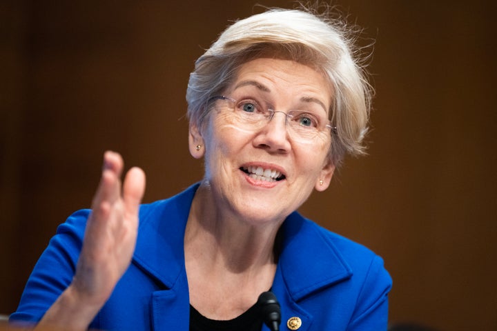 Sen. Elizabeth Warren (D-Mass.) questions Consumer Financial Protection Bureau Director Rohit Chopra during a Senate Banking, Housing and Urban Affairs Committee hearing on Nov. 30, 2023.