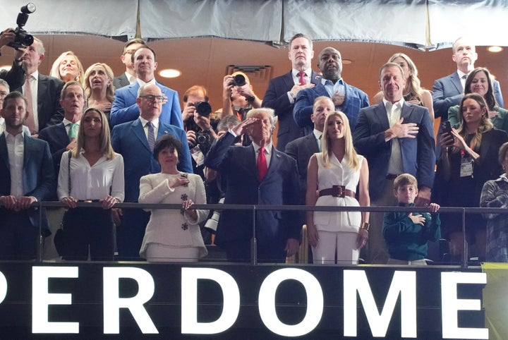 US President Donald Trump stands as US singer-songwriter Jon Baptiste performs the National Anthem ahead of Super Bowl LIX between the Kansas City Chiefs and the Philadelphia Eagles at Caesars Superdome in New Orleans, Louisiana, February 9, 2025. (Photo by TIMOTHY A. CLARY / AFP) (Photo by TIMOTHY A. CLARY/AFP via Getty Images) 