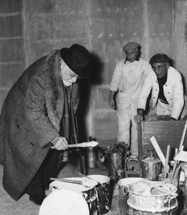 Famed French painter Henri Matisse looks over the brushes of painters currently redecorating the Galerie des Ponchettes at Nice, France on Jan. 11, 1950. The gallery is being prepared for a showing of Matisse?s works starting on January 26. (AP Photo)