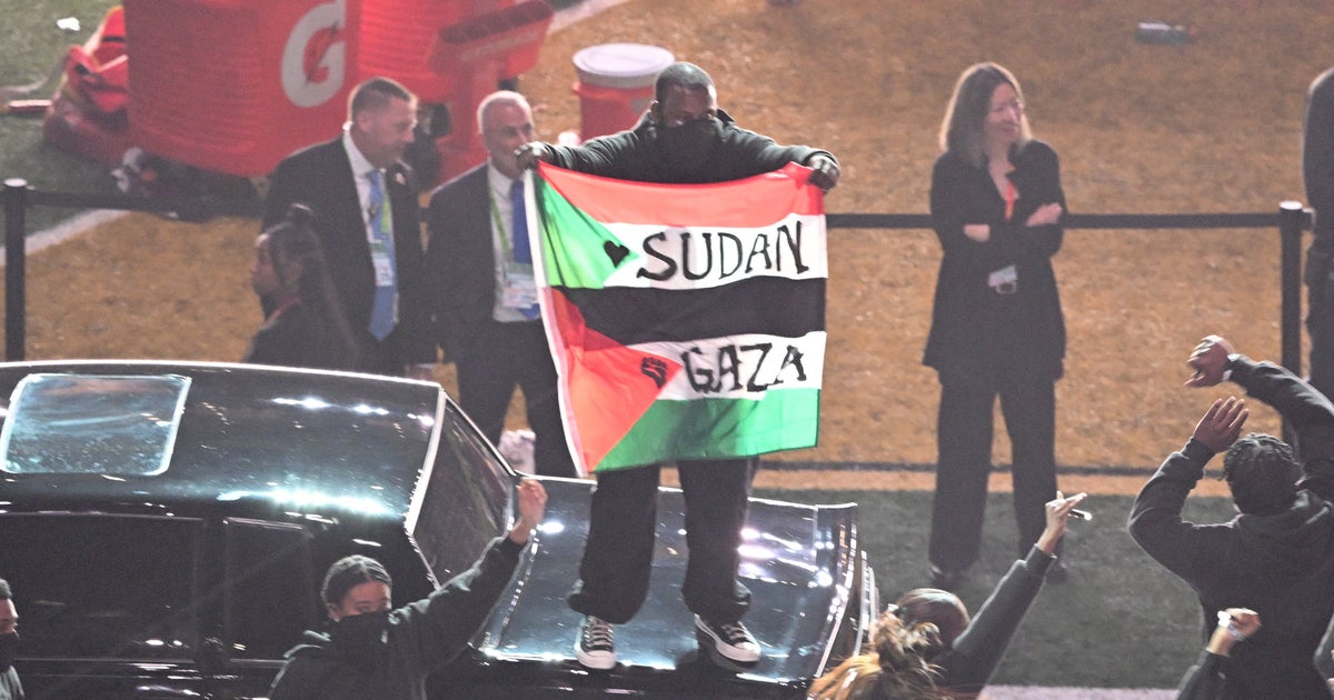 NextImg:Super Bowl Halftime Protester Gets Lifetime Ban After Gaza-Sudan Flag Stunt