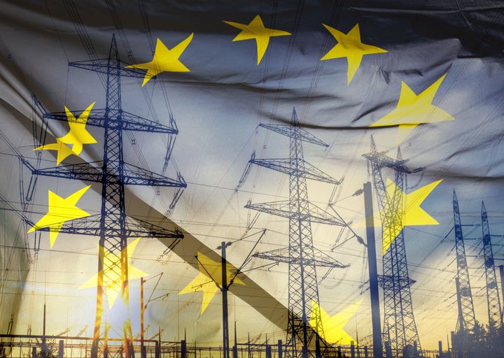 Many large electricity pylons with EU-flag overlay