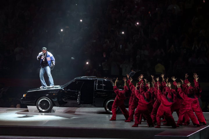 Kendrick Lamar performing atop a Buick Grand National at his Super Bowl hafltime show.