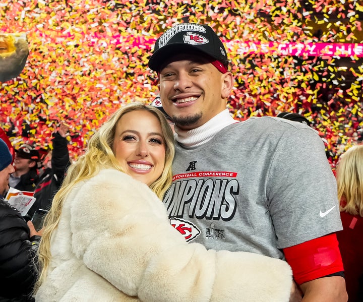 Mahomes poses for a photo with wife Brittany Mahomes after the AFC Championship game against the Buffalo Bills, at GEHA Field at Arrowhead Stadium on Jan. 26 in Kansas City, Missouri.