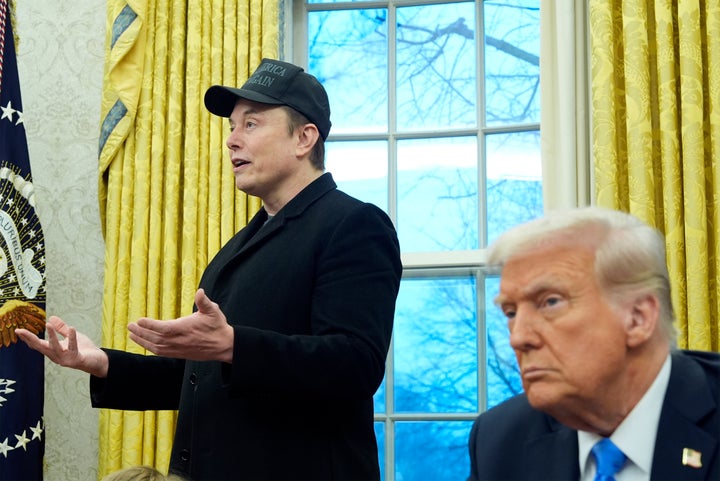 President Donald Trump listens as Elon Musk speaks in the Oval Office at the White House on Feb. 11, 2025.