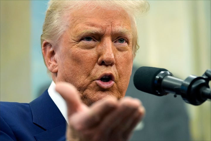 President Donald Trump speaks as Tulsi Gabbard is sworn in as the Director of National Intelligence in the Oval Office of the White House, Wednesday, Feb. 12, 2025, in Washington.