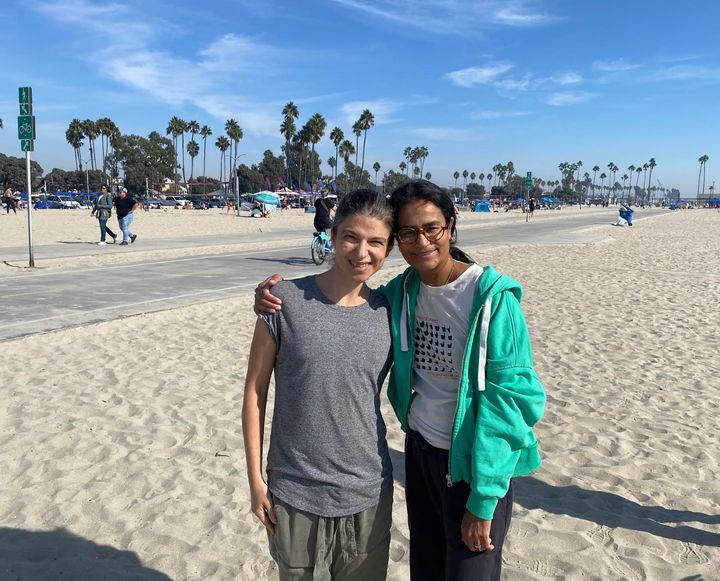 The author (left) and Nisha on November 11, 2024. "We're up and walking on the beach 11 days post-surgery," she writes.