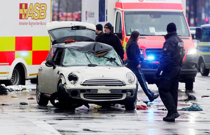 At Least 28 Injured After Driver Plows Into Demonstration In Germany 2 Police and emergency services stand near a damaged car that apparently drove into demonstrators marching in the city center on February 13, 2025 in Munich, Germany. (Photo by Johannes Simon/Getty Images)