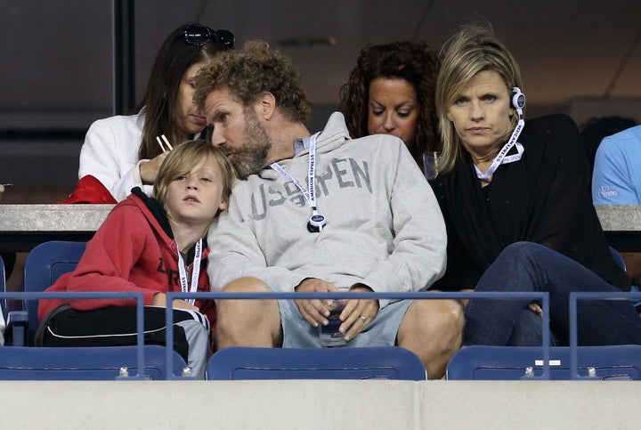 Will Ferrell sits with his son Magnus Ferrell and wife Viveca Paulin at the 2014 U.S. Open.