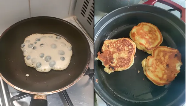 Pancake batter with blueberries, uncooked, on the left; fluffy pancakes cooking on the right