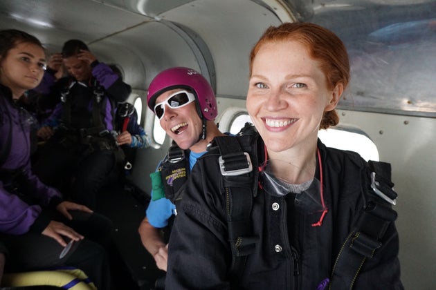 The author (right) mid-adventure, beaming with excitement inside a plane before skydiving on her first trip to Colorado.