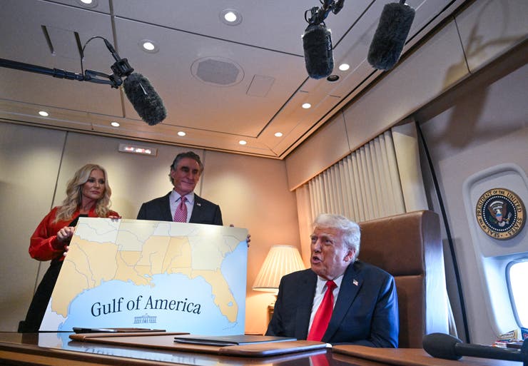 President Donald Trump speaks to the press after signing a proclamation renaming the Gulf of Mexico the "Gulf of America" aboard Air Force One on Feb. 9.