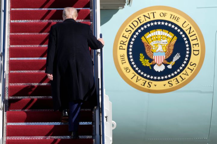 President Donald Trump boards Air Force One at Joint Base Andrews, Md., Friday, Feb. 14, 2025, en route to West Palm Beach, Fla. (AP Photo/Ben Curtis)