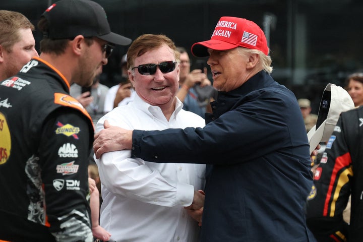 President Donald Trump is greeted by RCR team owner and NASCAR Hall of Famer, Richard Childress, at the Daytona 500 in Florida on Sunday.