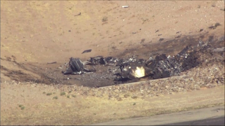 In this image taken from video, plane debris seen from above at Marana Regional Airport after a deadly crash in Arizona on Feb 19.