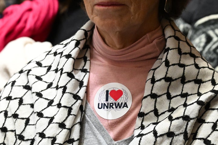 A woman wears a sticker in support of the United Nations Relief and Works Agency as Rep. Elise Stefanik (R-N.Y.) testifies before the Senate Foreign Relations Committee on her nomination to be ambassador to the United Nations, on Capitol Hill in Washington, D.C., Jan. 21, 2025.