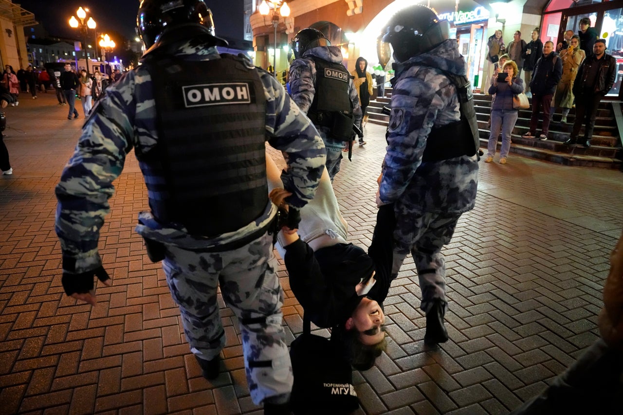 Riot police detain a demonstrator during a protest against mobilization in Moscow on Wednesday, Sept. 21, 2022. 