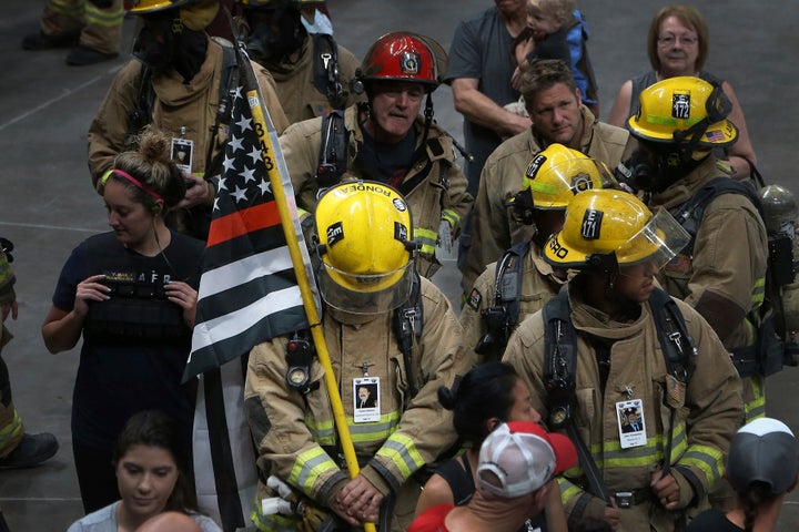 People remember the 9/11 terrorist attack at a commemorative event on Sept. 11, 2019, in Glendale, Arizona. The Trump administration was planning to cut staffing at the World Trade Center Health Program.