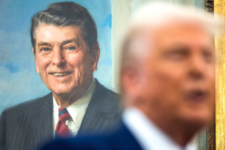 A painting of former US President Ronald Reagan behind US President Donald Trump.