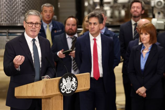 Prime Minister Keir Starmer, left, speaks as Chancellor of the Exchequer Rachel Reeves, right, and Secretary of State for Energy Security and Net Zero Ed Miliband listen at a factory in Chester, England, Friday, Oct. 4, 2024.