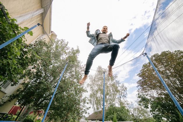 A man jumping on a trampoline