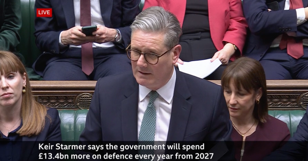 Keir Starmer in the Commons, announcing cuts to aid