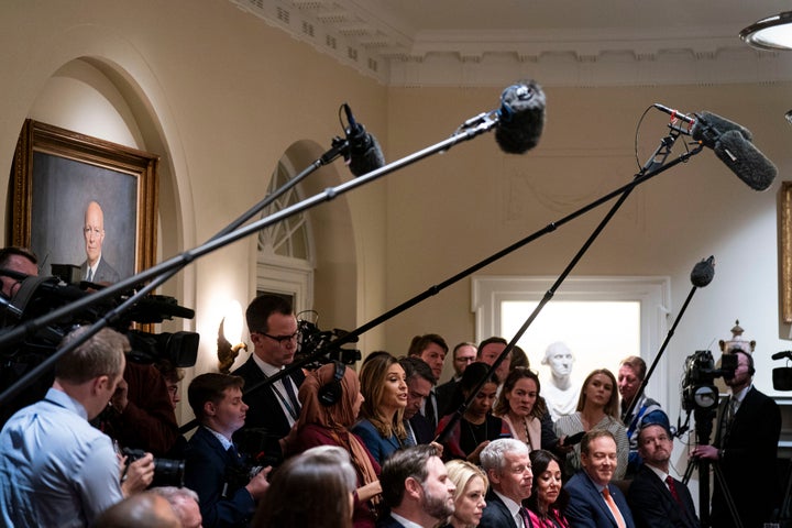 Members of the White House press pool ask questions during a Cabinet meeting on Feb. 26, 2025.
