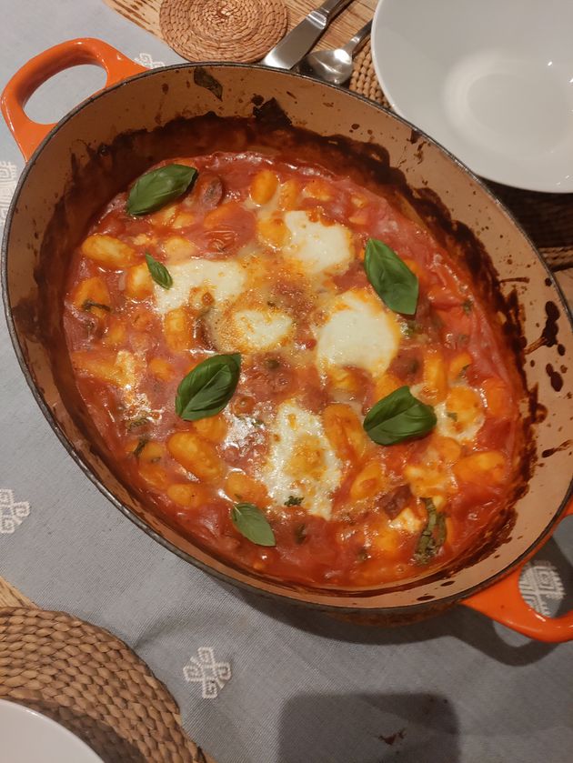 A casserole dish with tomato gnocchi bake