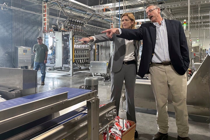 Then-USAID Administrator Samantha Power talks with Mana operations director Harry Broughton during a tour of Mana's Fitzgerald factory in May of 2024. Power's visit came as USAID announced the investment of $200 million to combat the food crises in Gaza and other parts of the world.