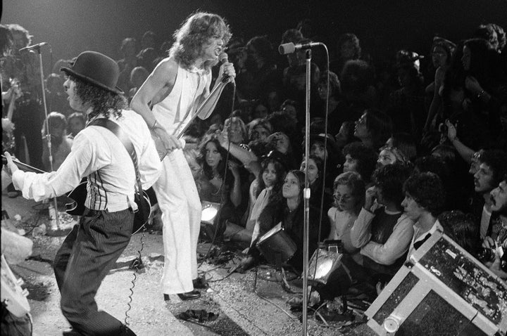 Rock group "The New York Dolls" perform at the Waldorf Halloween Ball, Waldorf-Astoria Hotel, NYC, Oct. 31, 1973. At right is lead singer David Johansen, with guitarist Sylvain Sylvain. (AP Photo/Richard Drew, File)