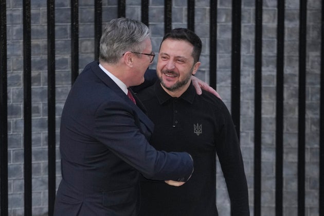 Britain's Prime Minister Keir Starmer, left, greets Ukraine's President Volodymyr Zelenskyy in Downing Street, London Saturday, March 1, 2025. (AP Photo/Kin Cheung)