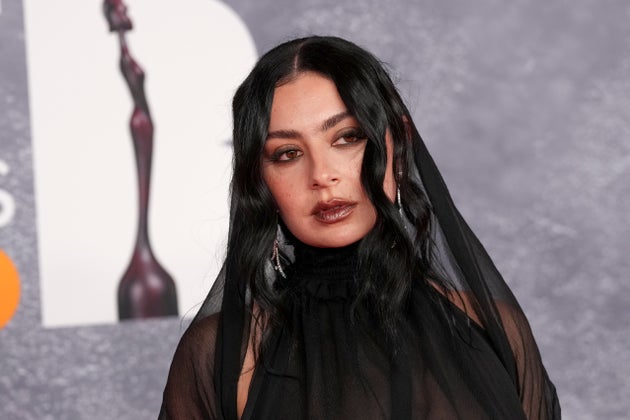 Charli xcx poses for photographers upon arrival at the Brit Awards 2025 in London, Saturday, March. 1, 2025. (Photo by Scott A Garfitt/Invision/AP)