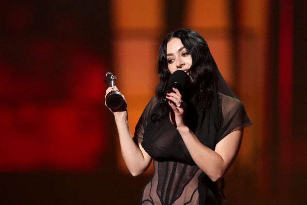 EDS NOTE: NUDITY - Charli xcx accepts the song of the year award for 'Guess' during the Brit Awards 2025 in London, Saturday, March 1, 2025. (Photo by Scott A Garfitt/Invision/AP)