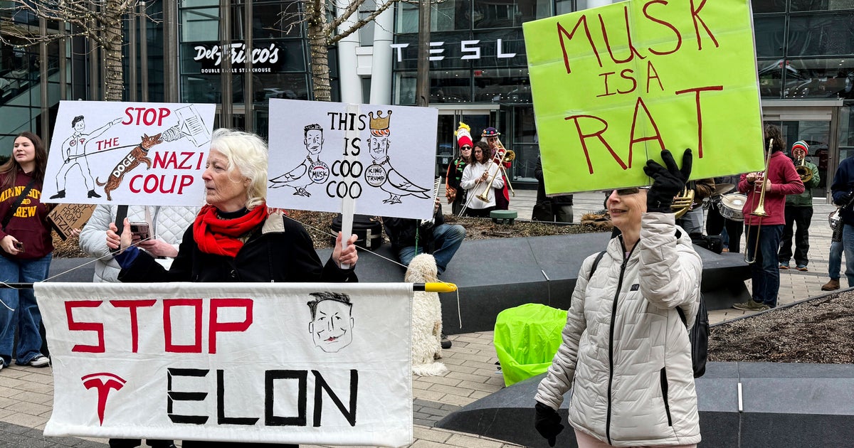 Anti-DOGE Protests At Tesla Stores Target Elon Musk's Bottom Line