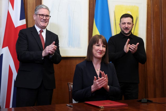 Keir Starmer, Rachel Reeves and Volodymyr Zelenskyy applaud during a video conference meeting with Ukraine's finance minister Sergii Marchenko.