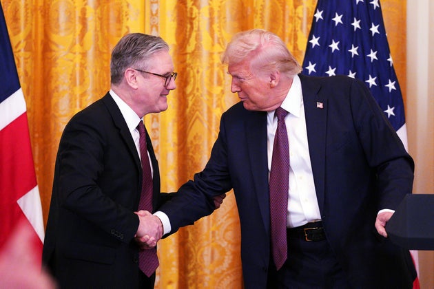 Keir Starmer and Donald Trump shake hands at a joint press conference in the East Room at the White House.