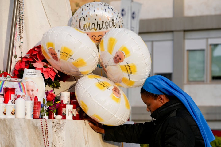 FILE - A nun prays for Pope Francis in front of the Agostino Gemelli Polyclinic, in Rome, Sunday, Feb. 23, 2025, where the Pontiff is hospitalized since Friday, Feb. 14. (AP Photo/Andrew Medichini, File)