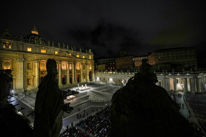 People attend a rosary prayer with Cardinal Victor Manuel Fernandez held for the health of Pope Francis in St Peter's Square at the Vatican, Friday, Feb. 28, 2025. (AP Photo/Andrew Medichini)