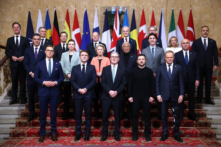 Keir Starmer, UK's prime minister, bottom center, Volodymyr Zelenskiy, Ukraine's president, bottom second right, and other world leaders at a family photo during a summit at Lancaster House in London, UK, on Sunday, March 2, 2025. Starmer is hosting Zelenskiy and more than a dozen other European leaders to discuss security guarantees the continent can offer Kyiv in the event of a ceasefire with Russia. Photographer: Neil Hall/EPA/Bloomberg via Getty Images