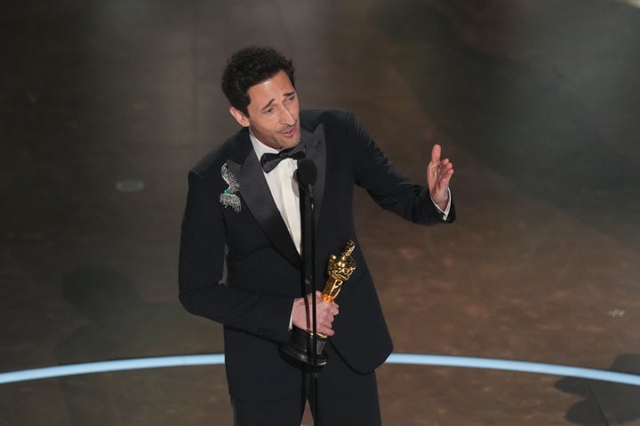 Adrien Brody accepts an Oscar for "The Brutalist" on Sunday. 