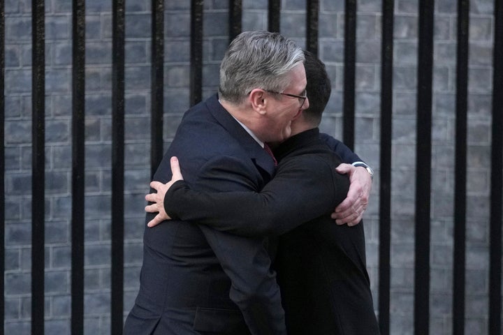 Britain's Prime Minister Keir Starmer, embraces and greets Ukraine's President Volodymyr Zelenskyy in Downing Street, London, on March 1, 2025.