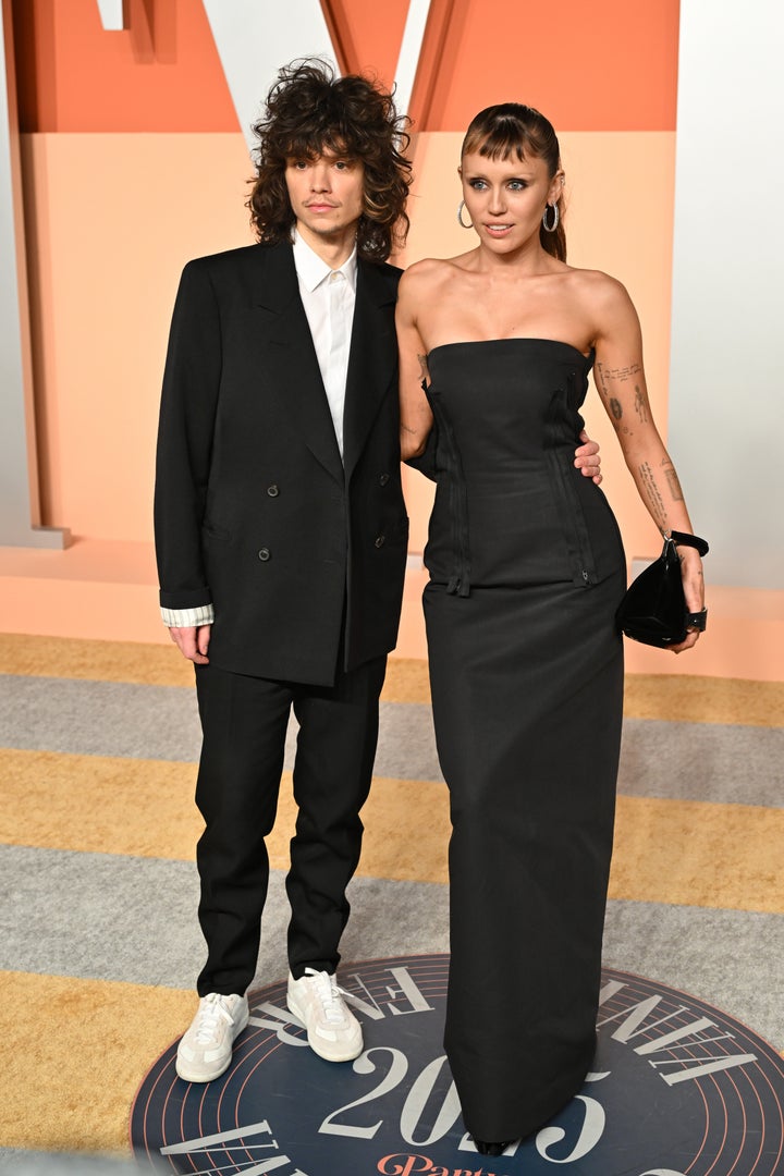 Cyrus and Morando attend the 2025 Vanity Fair Oscar Party.