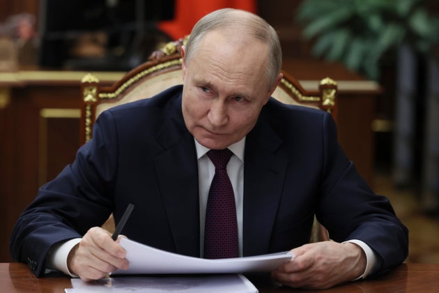 Russian President Vladimir Putin listens to the Head of Republic of Tatarstan Rustam Minnikhanov during their meeting at the Kremlin in Moscow, Russia, Monday, March 3, 2025. 