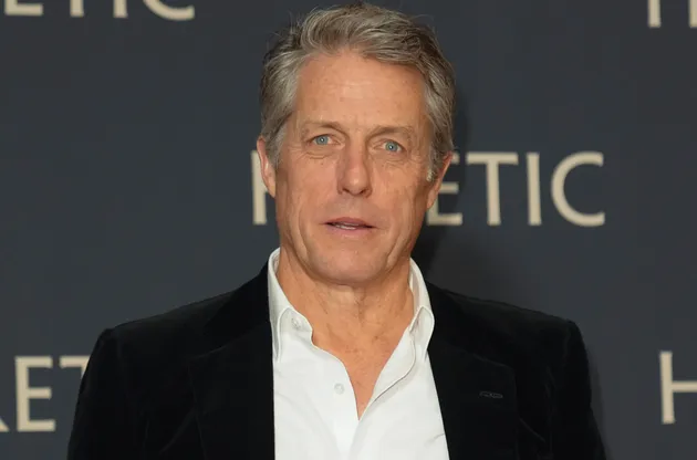 British actor Hugh Grant poses as he arrives at the France premiere of Heretic, in Paris, Tuesday, Nov. 19, 2024. (AP Photo/Thibault Camus)